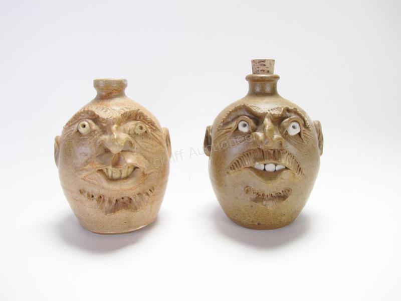 Appraisal: Two Art Pottery Face Jugs one with brown glaze mouth