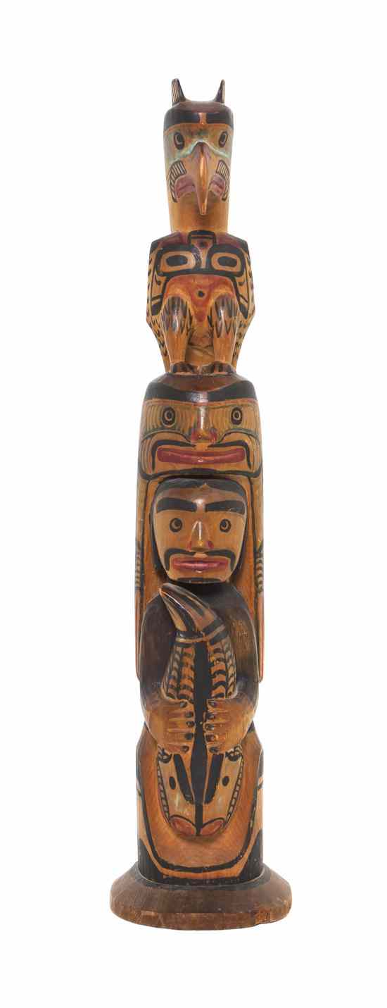 Appraisal: A Tsimshiam Polychrome Model Totem Pole having a raven surmounting