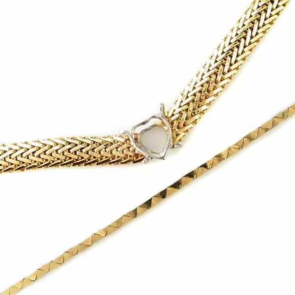 Appraisal: A collection of two k gold necklaces including a mesh