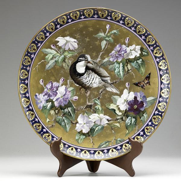 Appraisal: Bird-decorated porcelain plaque th C Gold highlights with flowers and