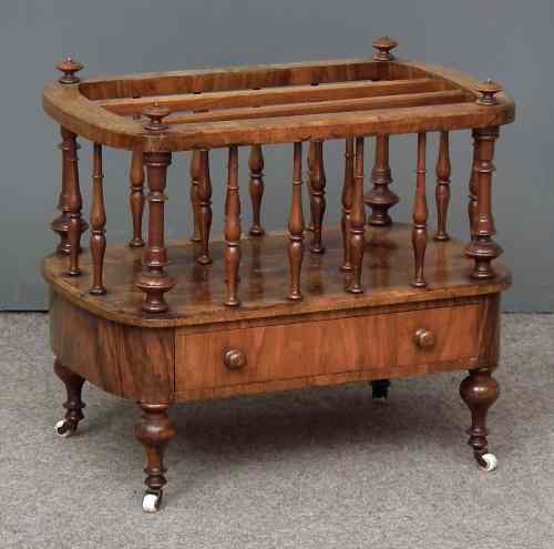 Appraisal: A Victorian walnut three division Canterbury with bowed sides on