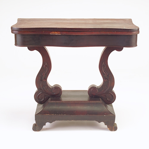 Appraisal: Empire mahogany card table with shaped and carved base as