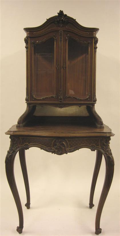 Appraisal: French mahogany and parcel gilt vitrine on stand In two