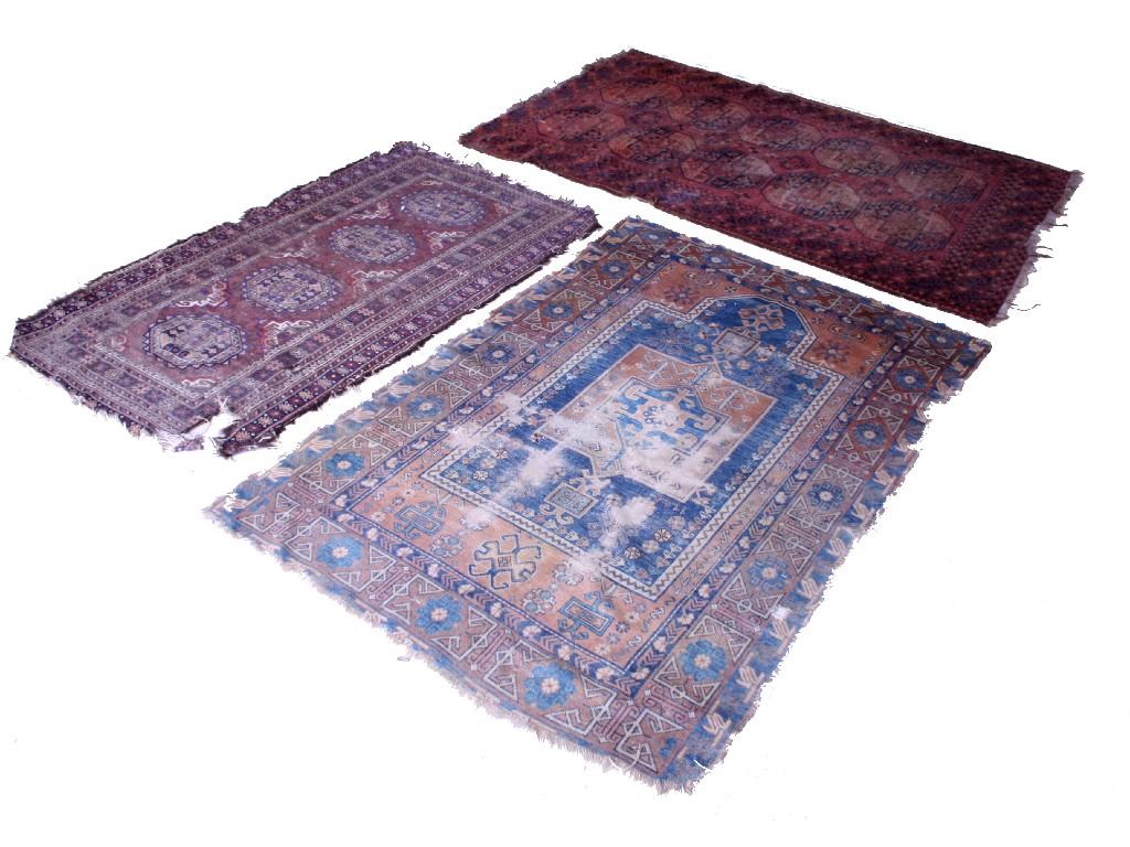 Appraisal: Three various Persian style prayer mats in need of restoration