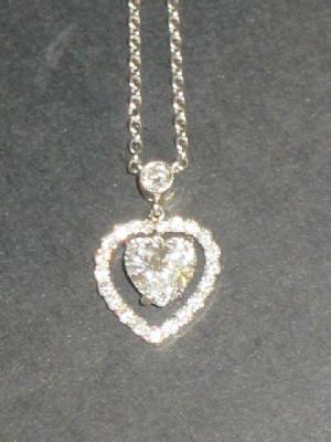 Appraisal: A DIAMOND PENDANT comprising heart cut diamond approximately cts claw