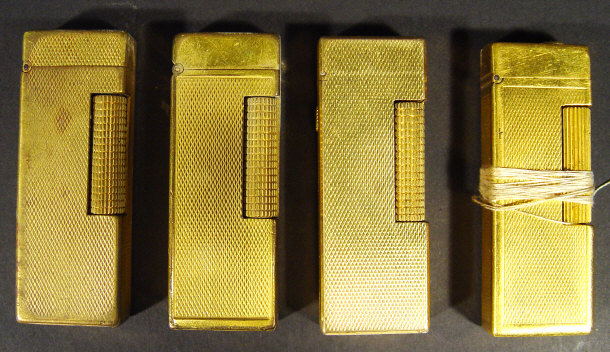 Appraisal: Four gold plated Dunhill lighters one with the original box