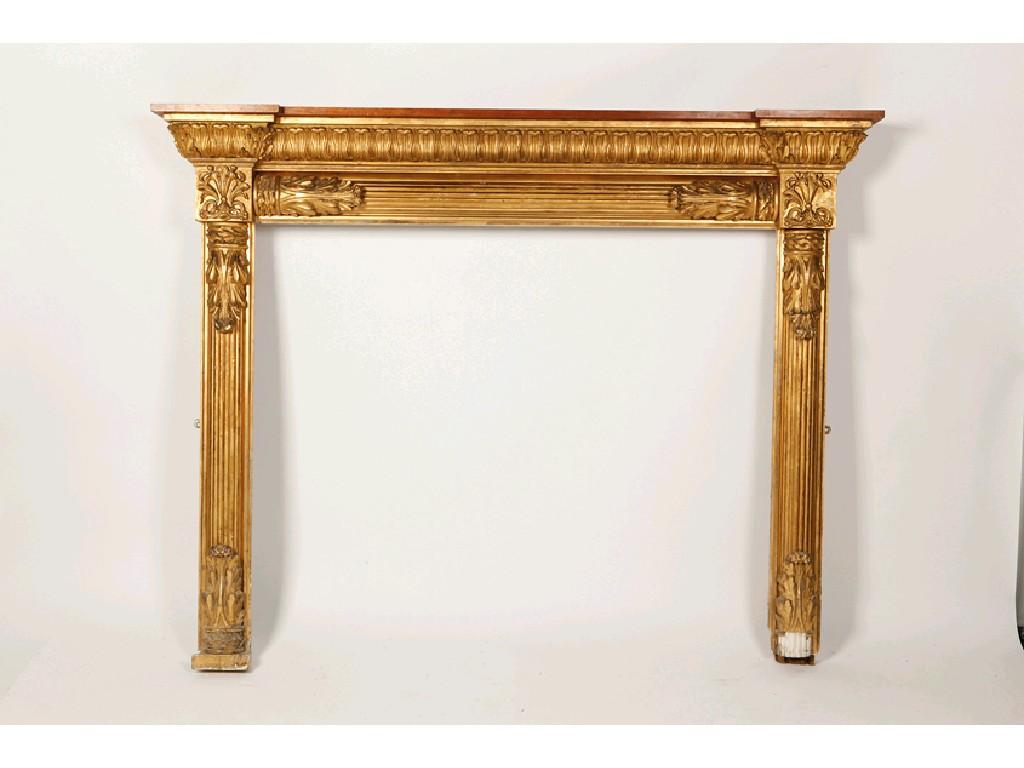 Appraisal: A REGENCY CARVED AND GILTWOOD FIREPLACE with an inverted breakfront