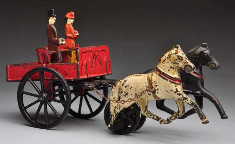 Appraisal: Cast Iron Carpenter Depot Wagon Horse-Drawn Toy Description Includes one