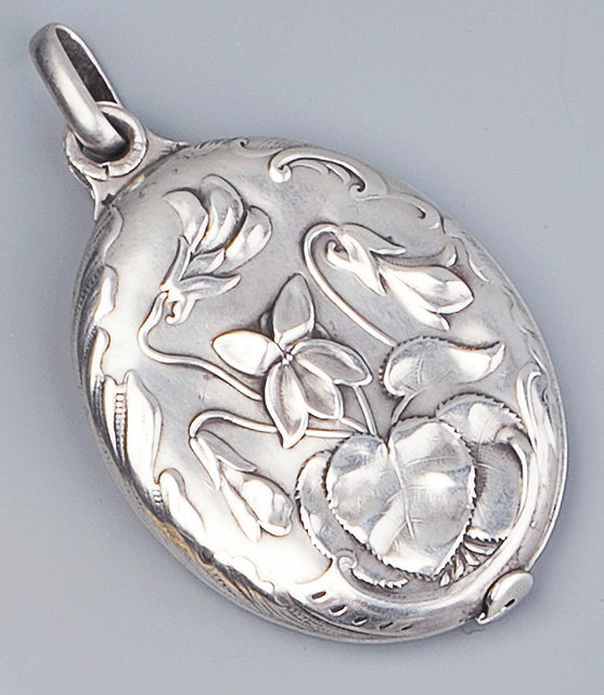 Appraisal: A FRENCH ART NOUVEAU SILVER PENDANT the oval pendant of