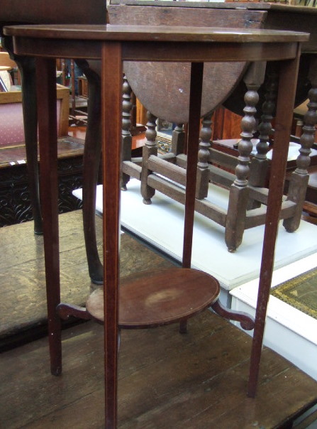 Appraisal: An Edwardian mahogany and boxwood oval occasional table raised on