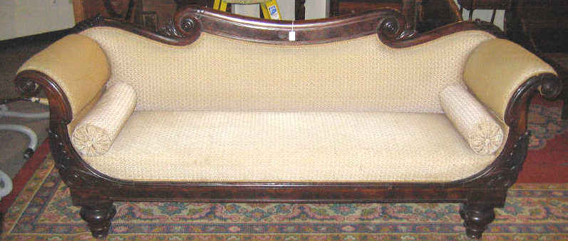 Appraisal: AMERICAN CLASSICAL REVIVAL MAHOGANY SETTEE Rolling crest terminating with scrolls