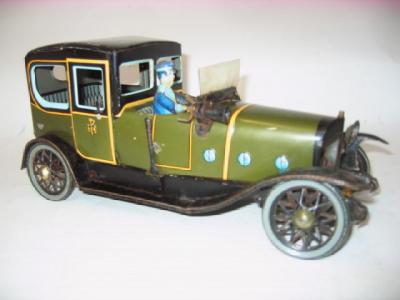 Appraisal: An early th century cabriolet with chauffer tinplate clockwork operated