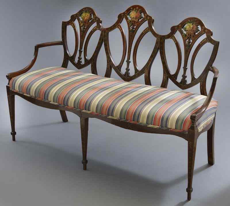 Appraisal: Hepplewhite style mahogany chair back settee the shield shaped triple