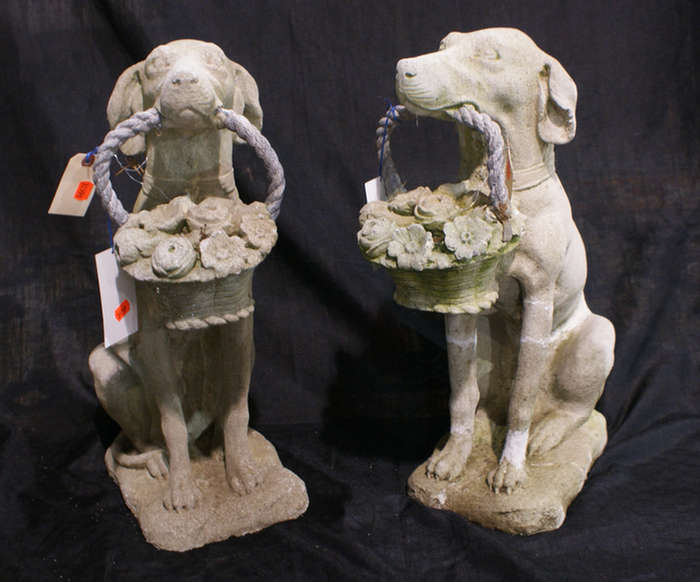 Appraisal: Pair of concrete seated dogs with floral baskets in mouths