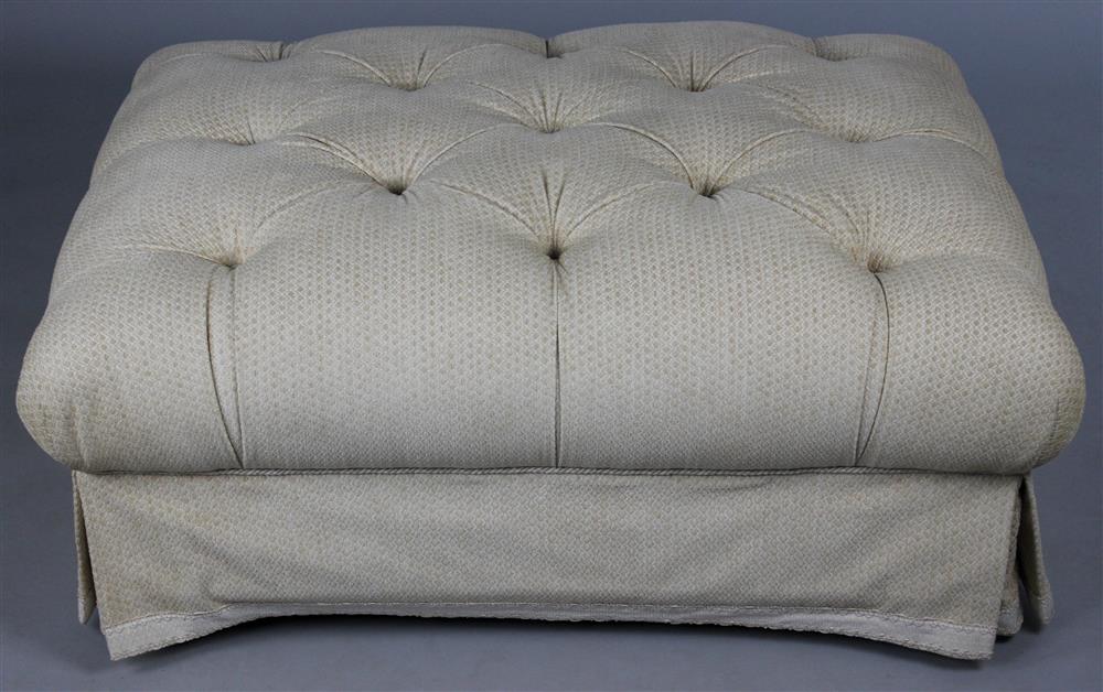 Appraisal: DESIGNER TUFTED UPHOLSTERED LARGE OTTOMAN padded top above cording over