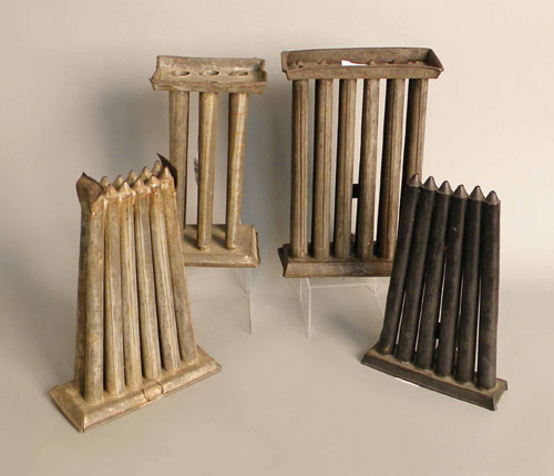 Appraisal: Four tin candlemolds th c