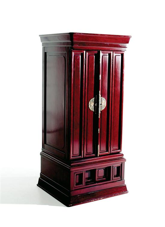 Appraisal: Chinese hardwood shrine cabinet molded crown over paneled bi-fold doors