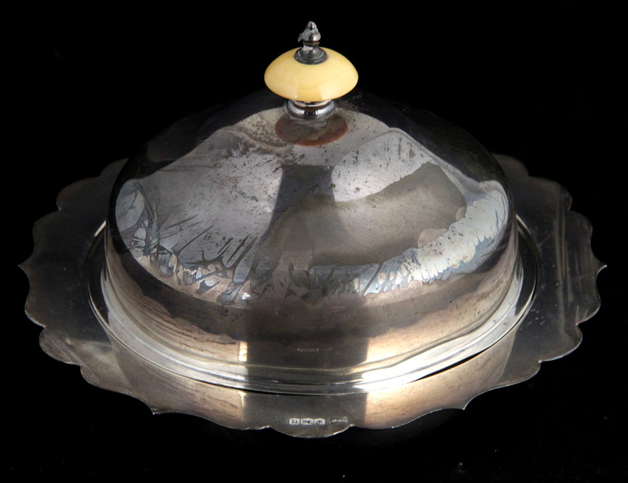 Appraisal: A silver muffin dish Walker Hall Sheffield with domed cover