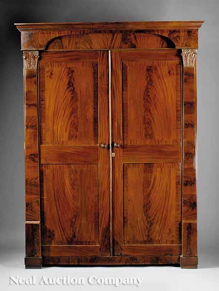 Appraisal: An American Late Classical Carved Mahogany Armoire c a cornice