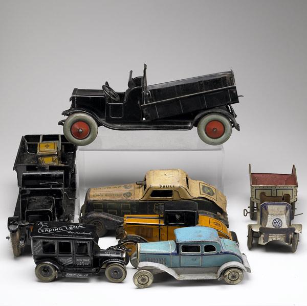 Appraisal: TIN TOY VEHICLES Grouping of eight includes Leo Strauss Leaping