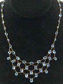 Appraisal: A blue topaz necklace set in yellow metal tests ct