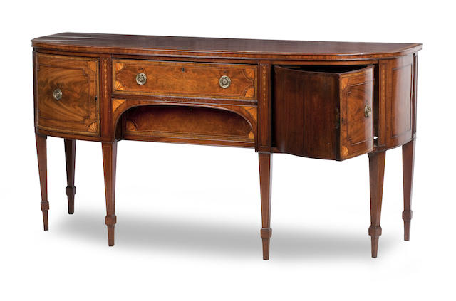 Appraisal: A Regency Mahogany and inlaid sideboard The rectangular bowfronted top