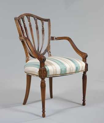 Appraisal: A Hepplewhite Style Arm Chair Pierced arched shield back with