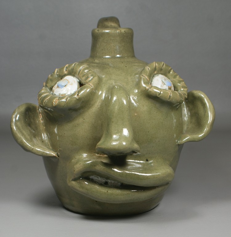 Appraisal: Jerry Brown Pottery face jug Hamilton AL h inscribed For