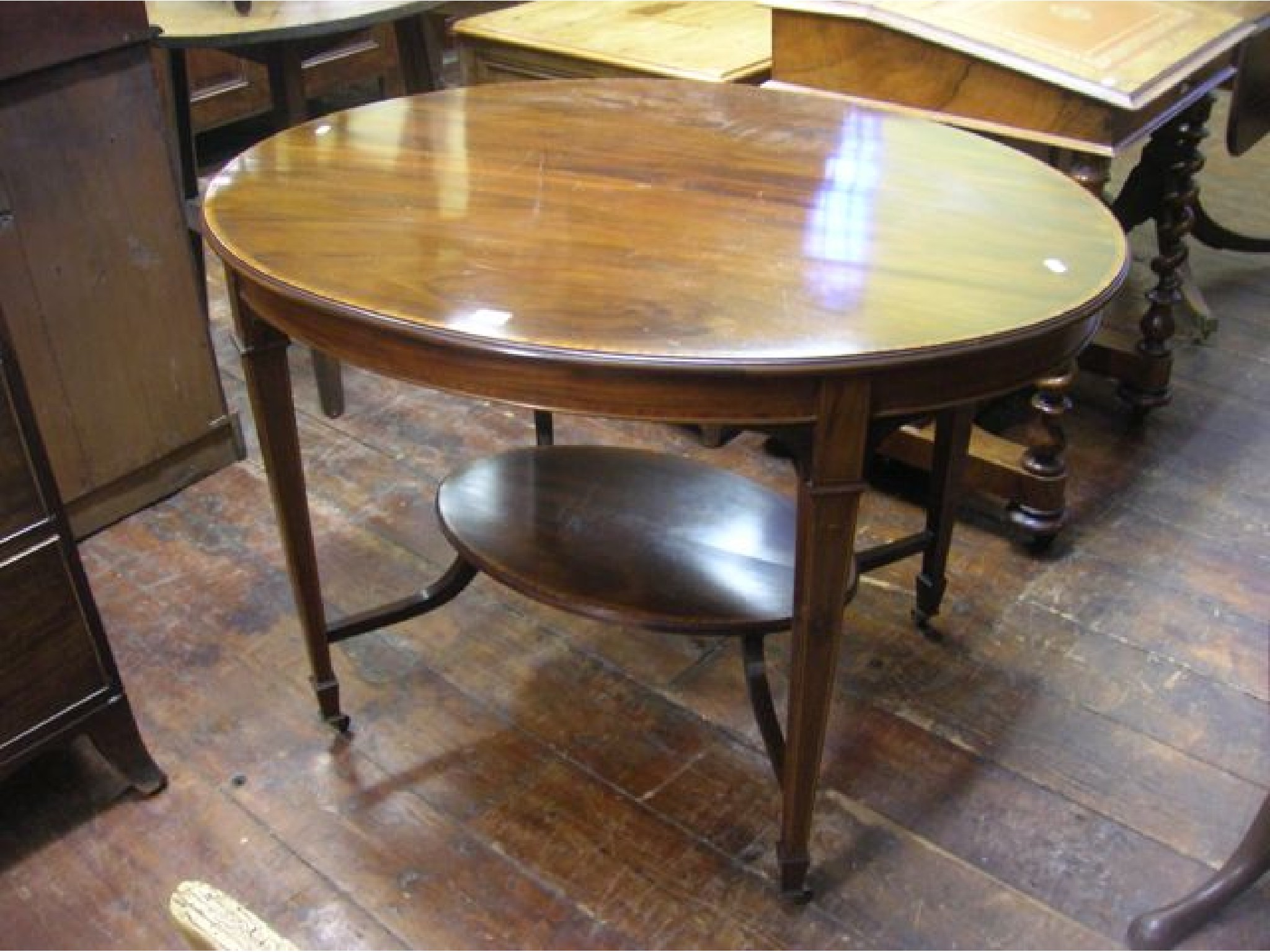 Appraisal: An inlaid Edwardian mahogany occasional table of unusual size the