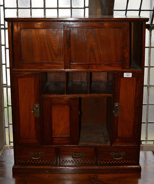 Appraisal: A Japanese keyaki elm cupboardwith various compartments and inlaid decoration