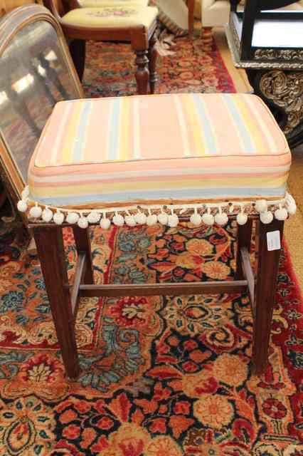 Appraisal: A SMALL MAHOGANY RECTANGULAR STOOL with overstuffed upholstered seat and