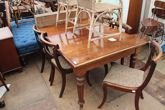 Appraisal: A VICTORIAN MAHOGANY WIND OUT EXTENDING DINING TABLE the rectangular