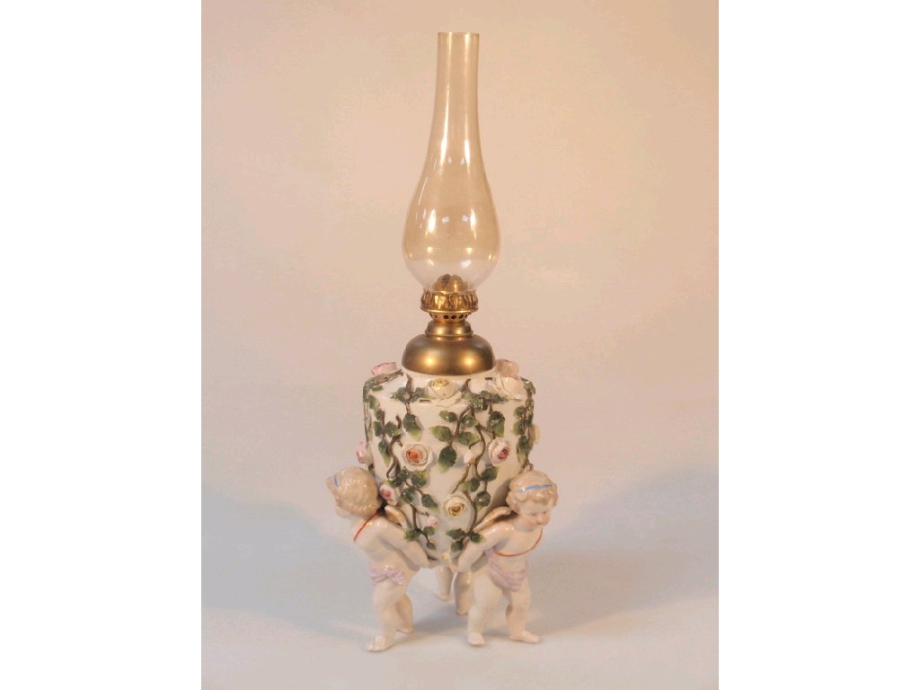 Appraisal: A Sitzendorf porcelain oil lamp the ovoid body encrusted with