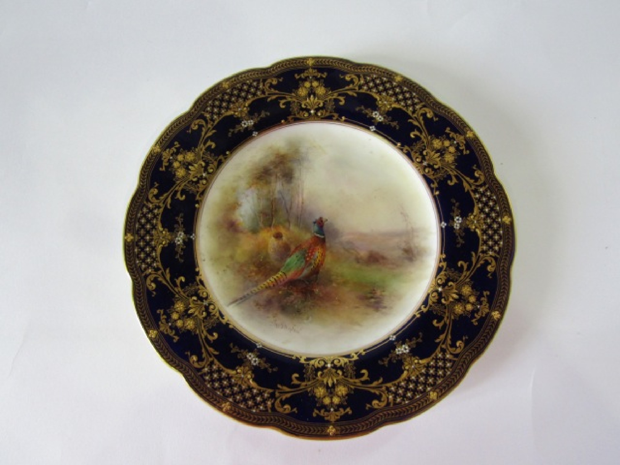 Appraisal: A Royal Worcester cabinet plate with painted central panel of