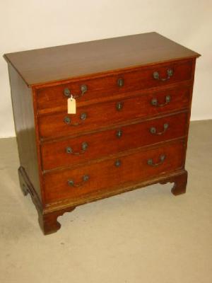 Appraisal: A GEORGE III OAK CHEST of four graduated cockbeaded drawers