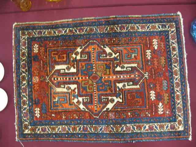 Appraisal: Heriz Persian Handmade Mat central geometric design primarily reds blues