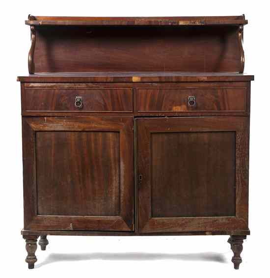 Appraisal: A Regency Style Mahogany Chiffonier having a galleried shelf over