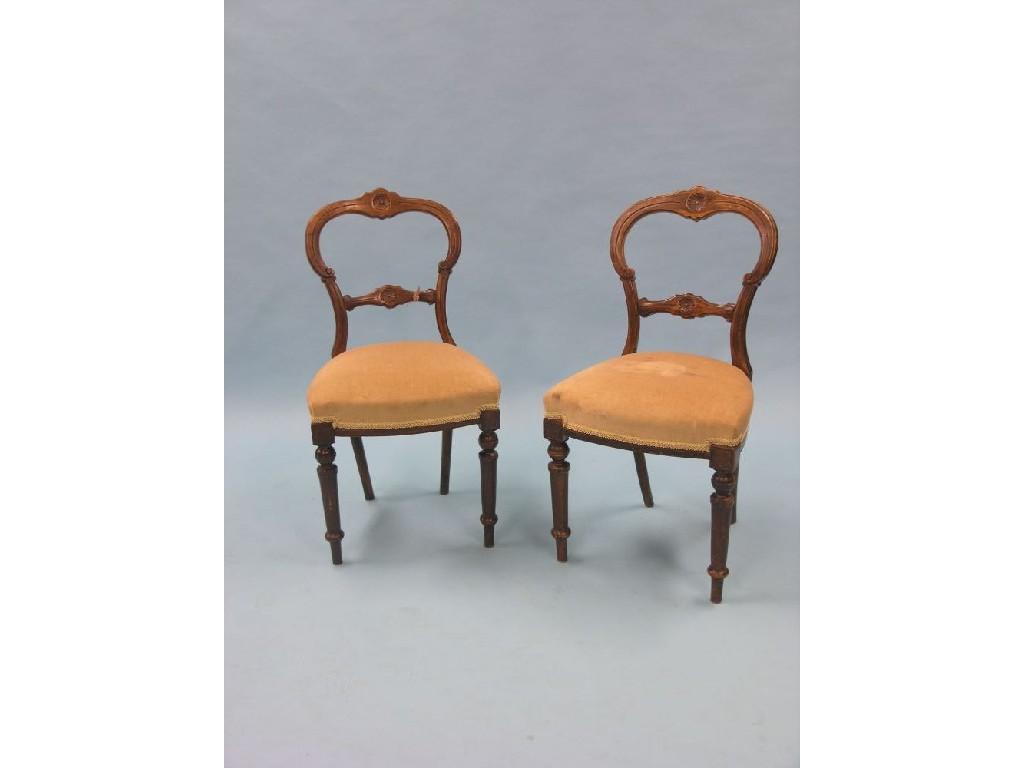 Appraisal: A pair of Victorian balloon-back dining chairs with upholstered seats