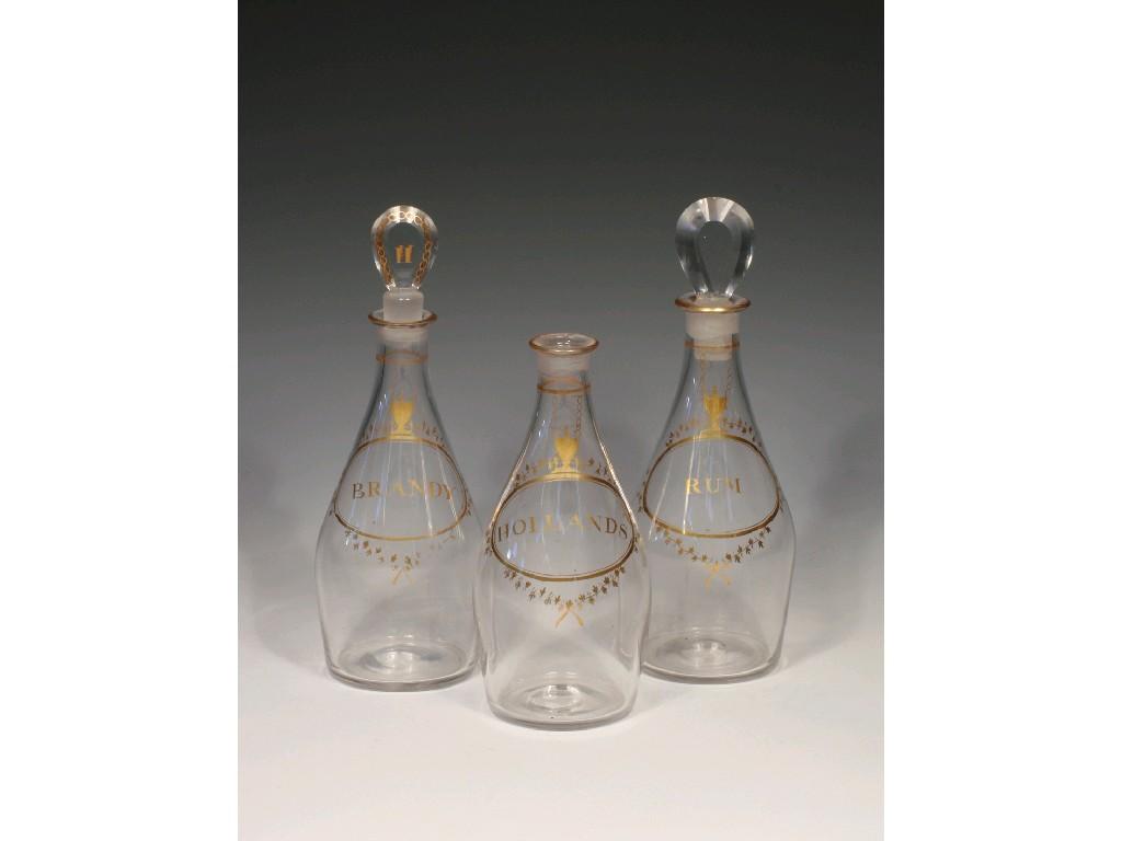 Appraisal: A SET OF THREE GEORGE III CLEAR GLASS DECANTERS each