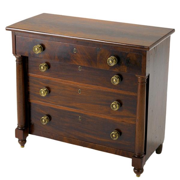 Appraisal: EMPIRE MAHOGANY FOUR-DRAWER CHEST With a writing surface in top