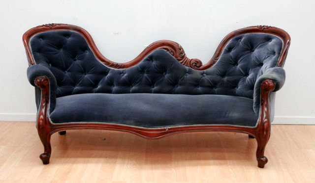 Appraisal: A Victorian mahogany chair-backed three seater sofa with button backed