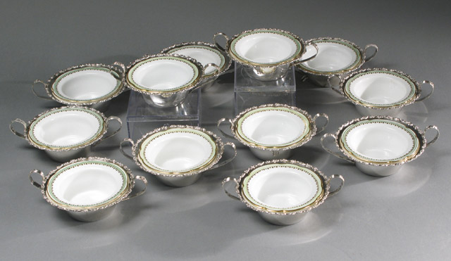 Appraisal: SET OF TWELVE PORCELAIN STERLING RAMEKINS by Shreve Co The