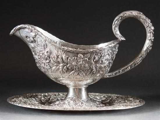 Appraisal: American sterling silver gravy boat and undertray in the ''Repousse''