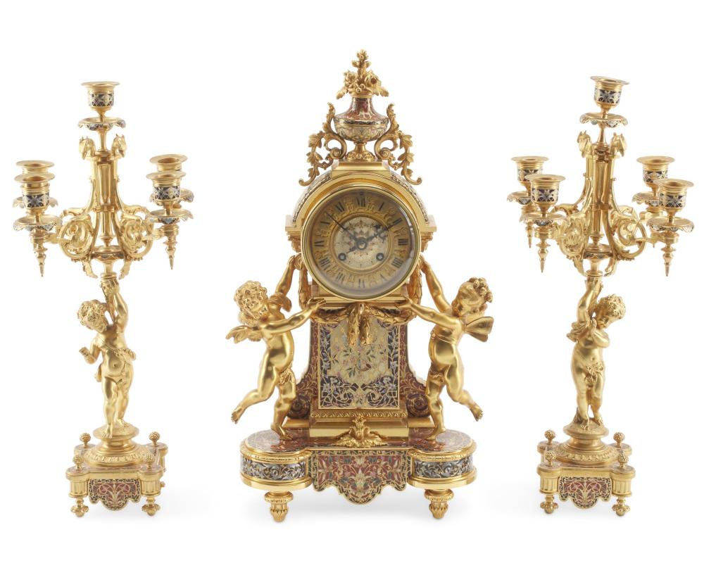 Appraisal: A FRENCH GILT-BRONZE AND CHAMPLEVE MANTLE CLOCK SETA French gilt-bronze