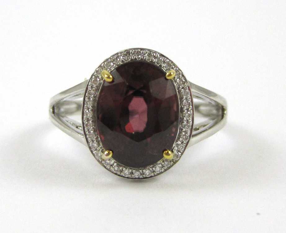 Appraisal: RED ZIRCON DIAMOND AND FOURTEEN KARAT GOLD RING The white