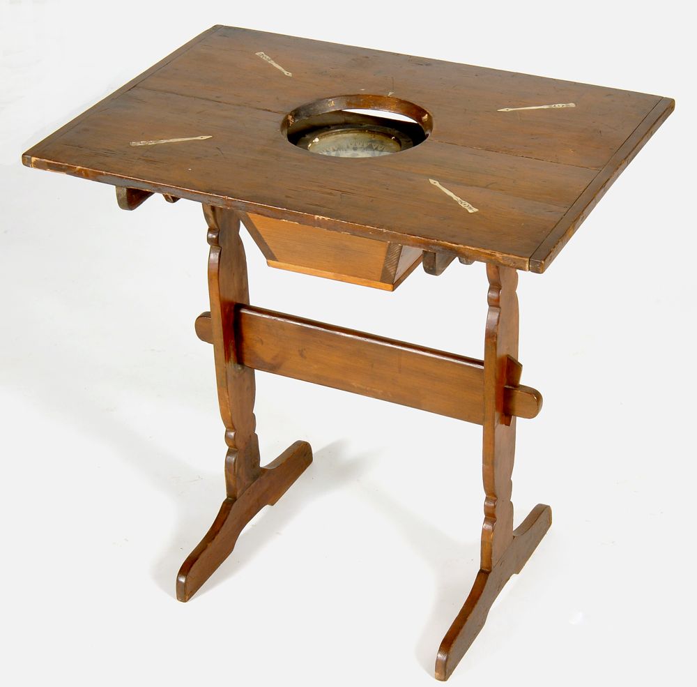 Appraisal: COUNTRY-MADE TRESTLE-BASE TABLE WITH INSET COMPASS In pine Breadboard top