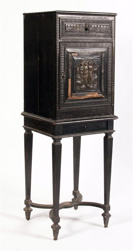 Appraisal: A Flemish ebonised cabinet on stand the rectangular top over