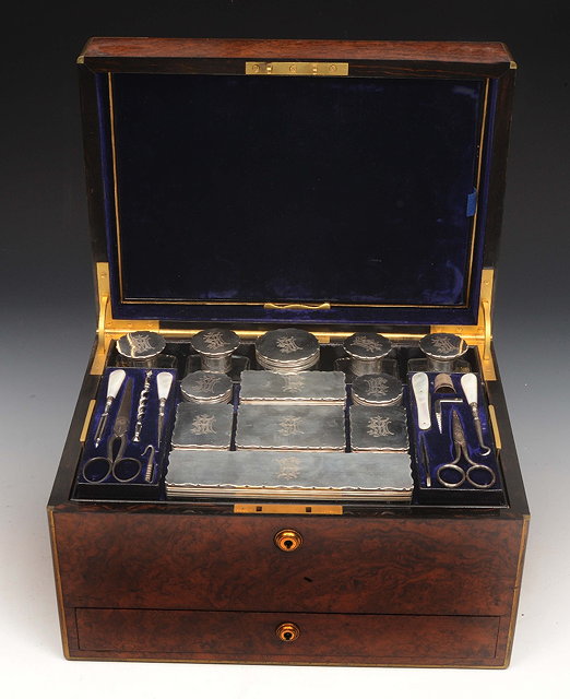 Appraisal: A VICTORIAN WALNUT AND BRASS BOUND GENTLEMANS DRESSING BOX the