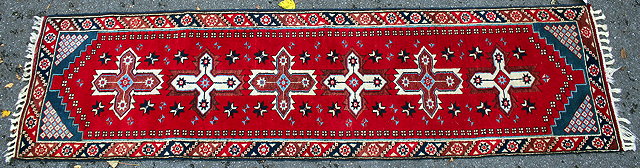 Appraisal: A LATE TH CENTURY MIDDLE EASTERN RED GROUND RUNNER with