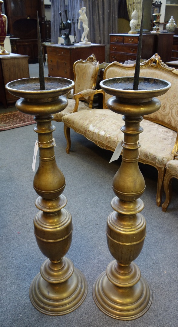 Appraisal: A pair of large brass altar candlesticks North European late